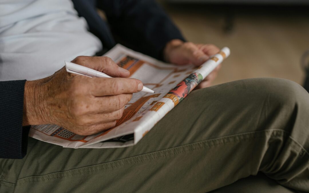 Man Solving Crossword Puzzle